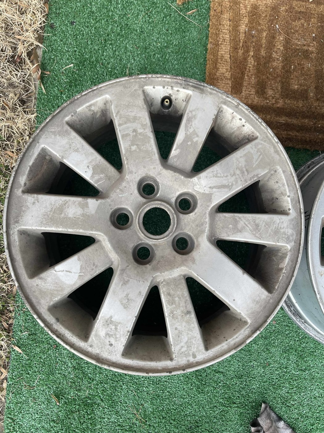 Before: ten-spoke wheel with wear and deteriorated finish