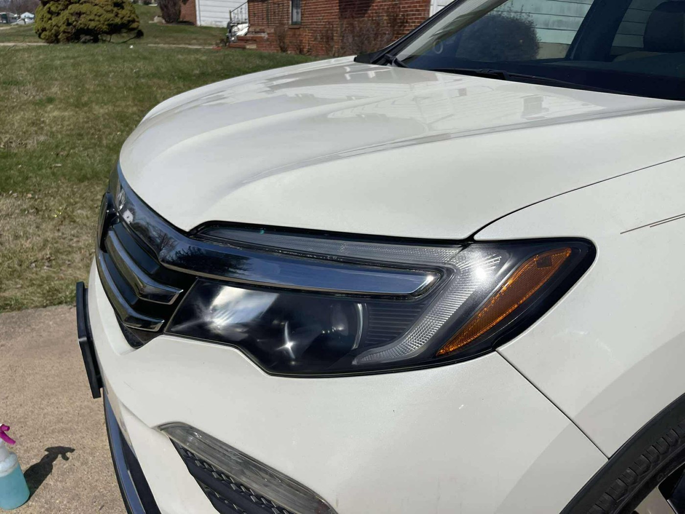 Restored headlight on a white Honda SUV