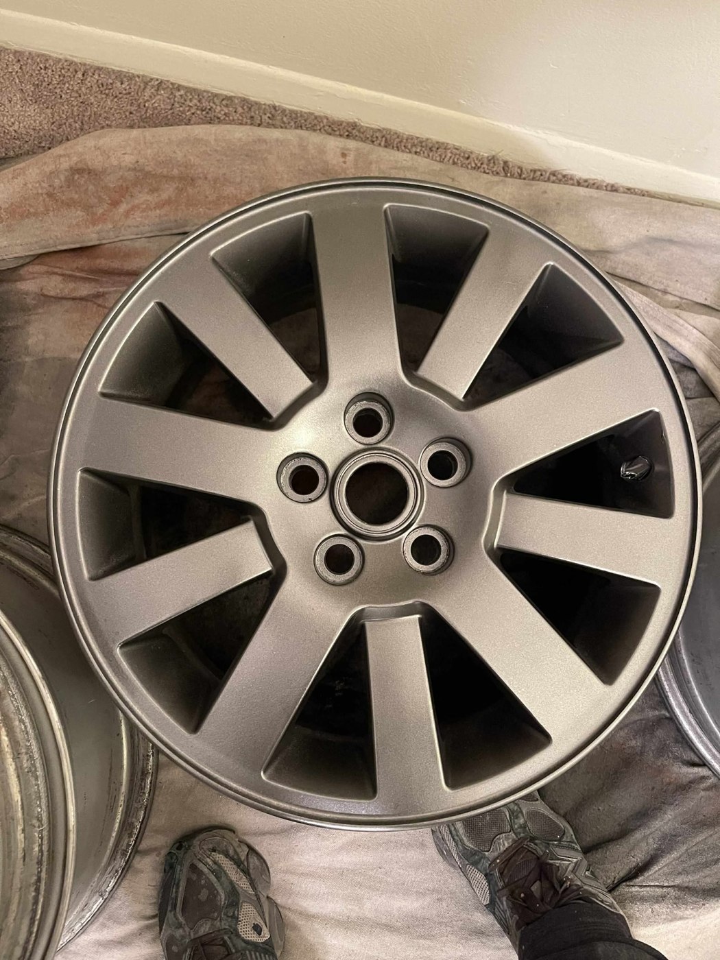 After: ten-spoke wheel with a refinished metallic surface